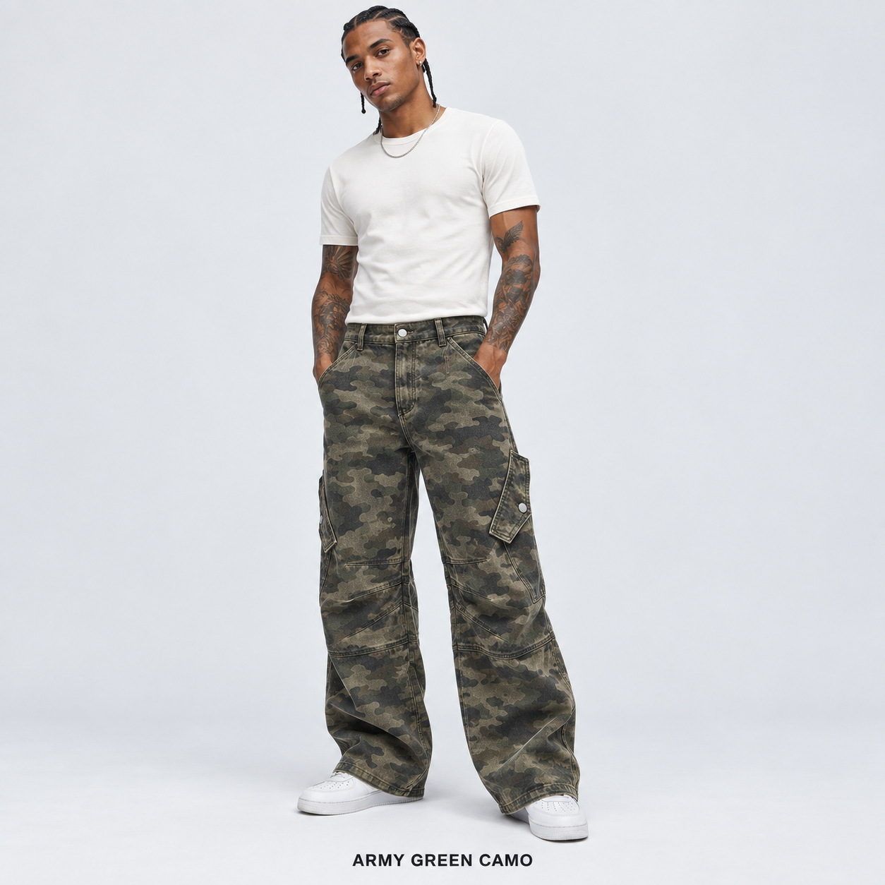 Men's Army Green Camo overdyed baggy utility cargo pants worn by an adult model