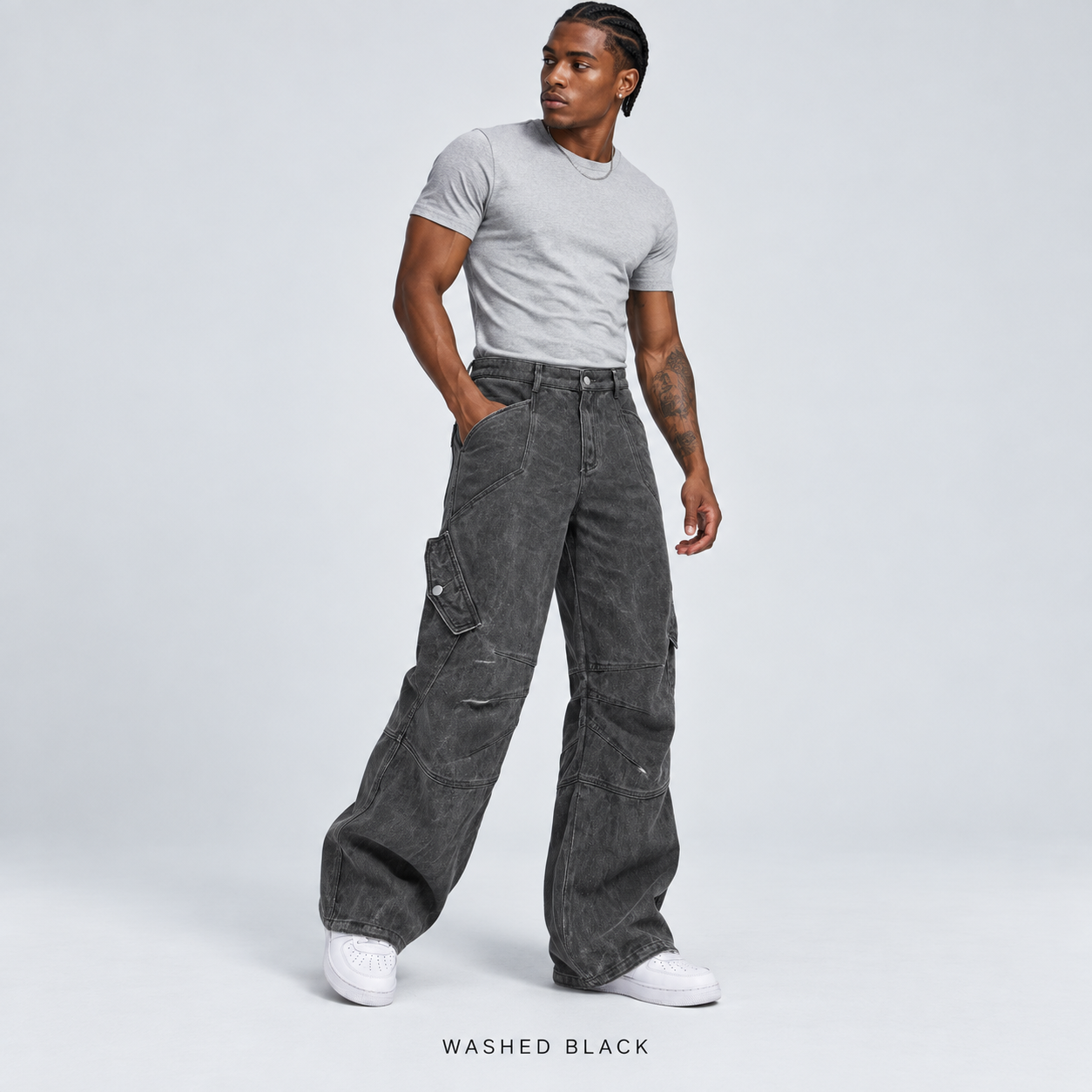 Men's Washed Black overdyed baggy utility cargo pants worn by an adult model