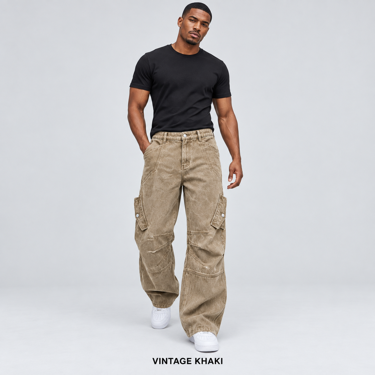 Men's Vintage Khaki overdyed baggy utility cargo pants worn by an adult model