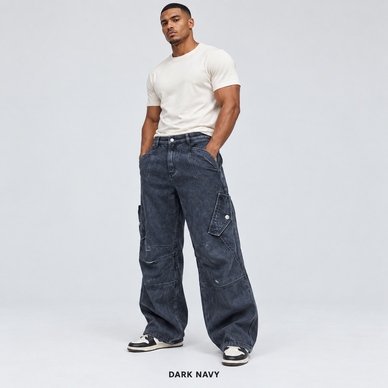 Men's Dark Navy overdyed baggy utility cargo pants worn by an adult model