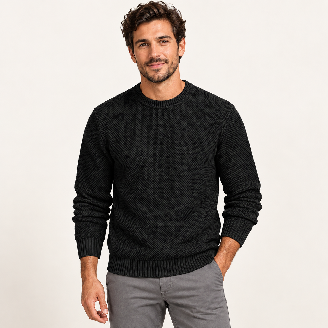 Adult male wearing the Black waffle-knit crewneck sweater