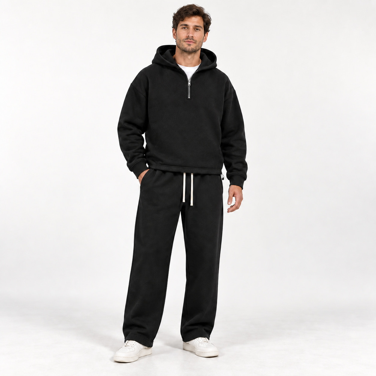Black unisex half-zip hooded sweatshirt and matching straight-leg sweatpants front fit