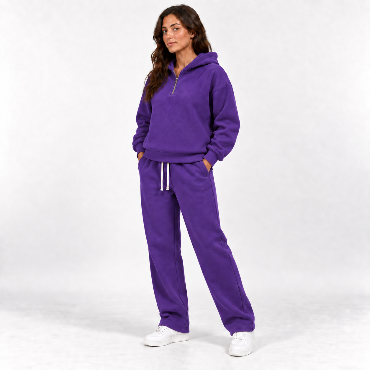 Purple unisex half-zip hoodie and straight-leg sweatpants complete two-piece set