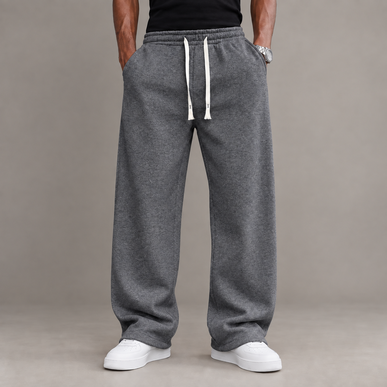 Adult male model wearing the Dark Grey unisex relaxed straight-leg casual pants