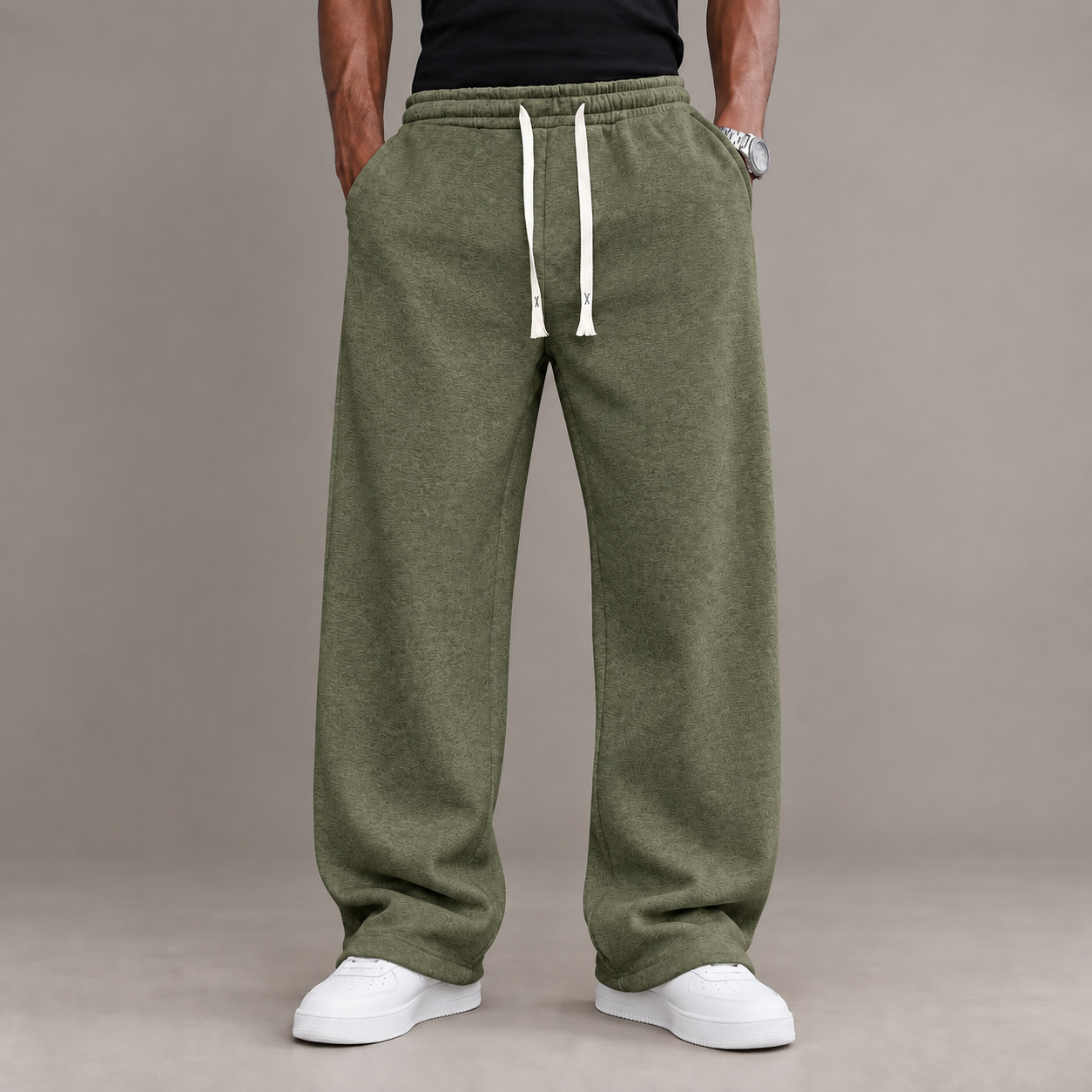Adult male model wearing the Olive Green unisex relaxed straight-leg casual pants
