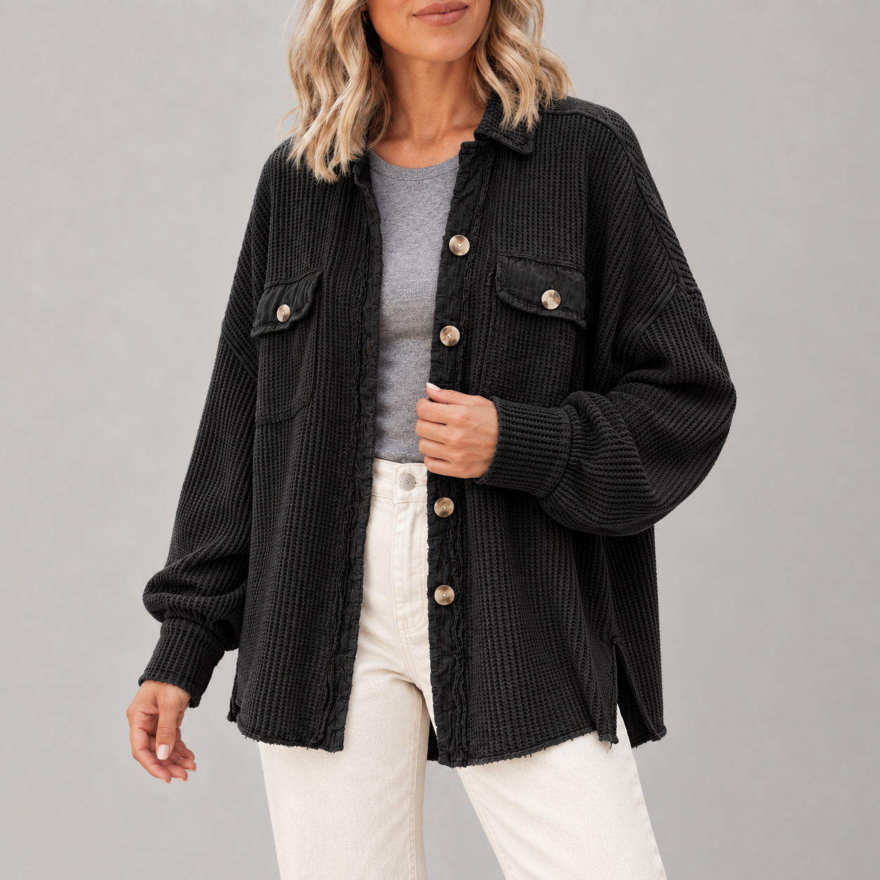 Adult woman wearing the Black waffle-knit button shacket