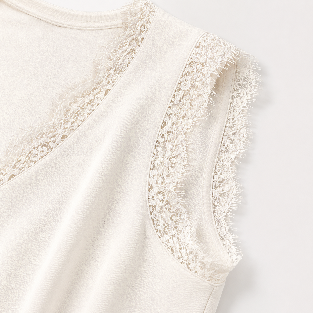 Close-up of floral eyelash lace neckline and armhole trim