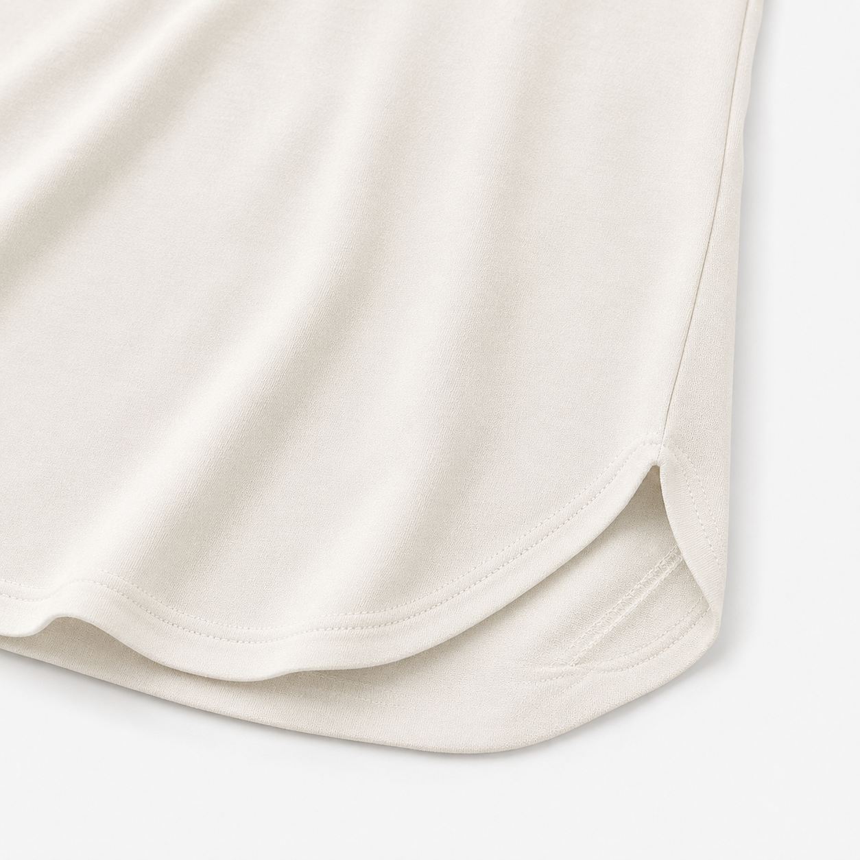 Close-up of rounded hem and small side slit