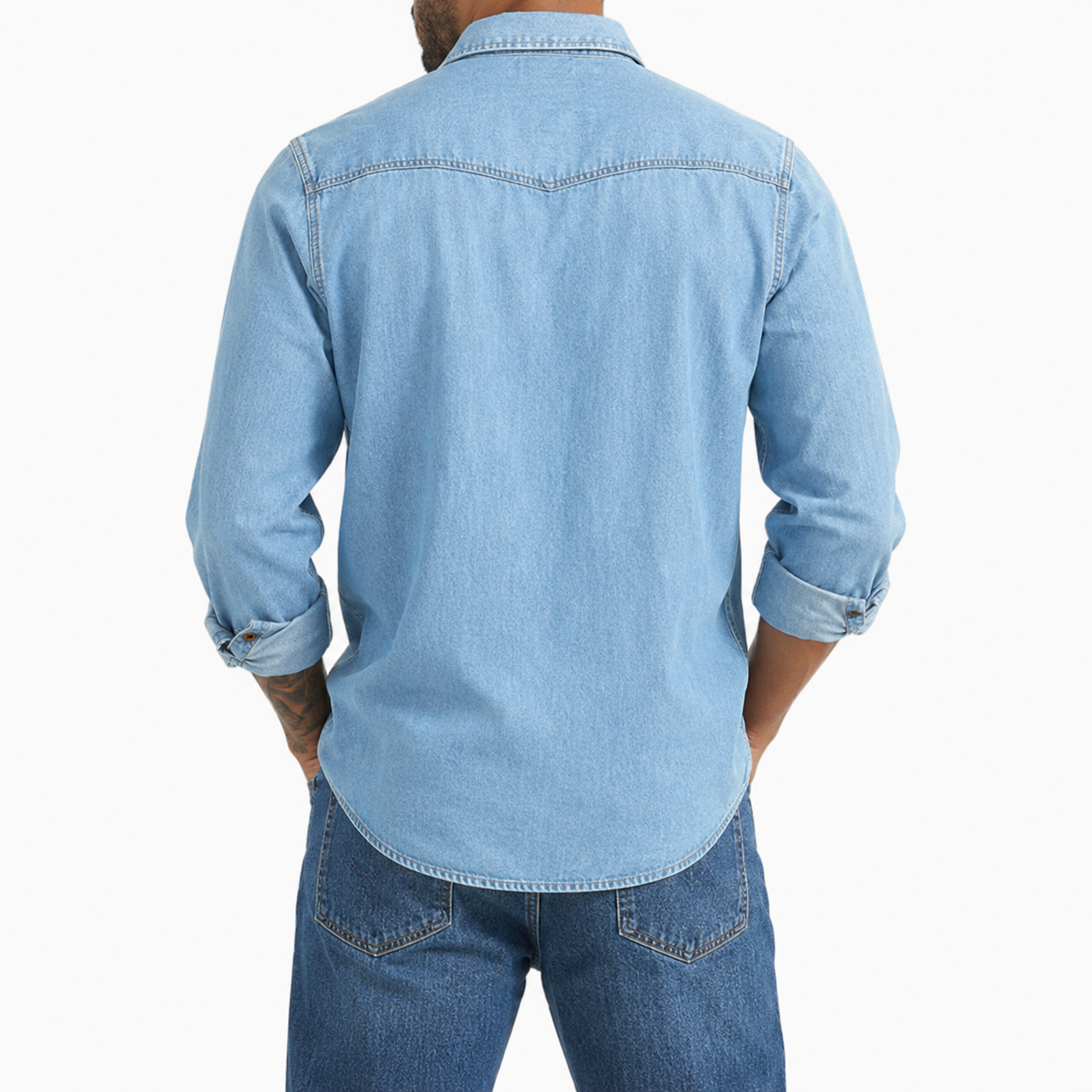Back view of light wash blue denim button-up shirt