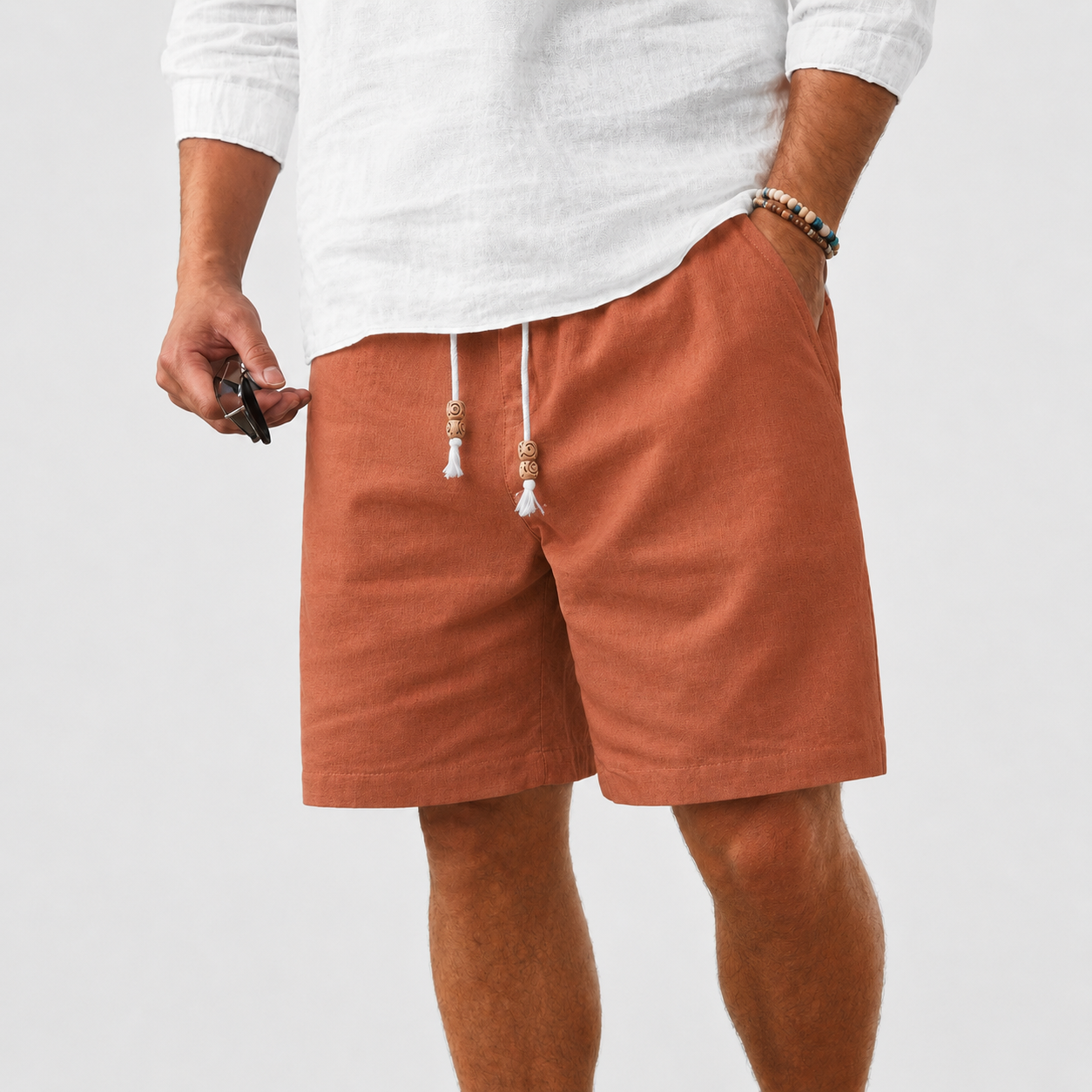 Men's linen shorts, elastic waistband with drawstring, casual style.