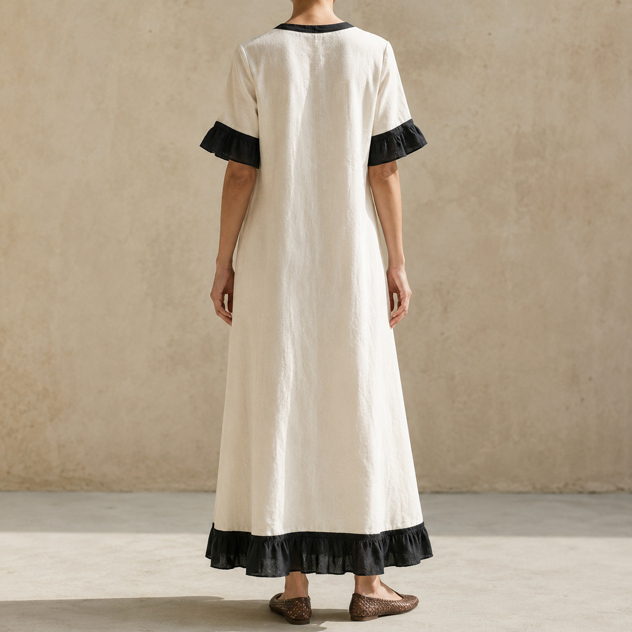 Ivory black contrast V-neck ruffle hem maxi dress back view