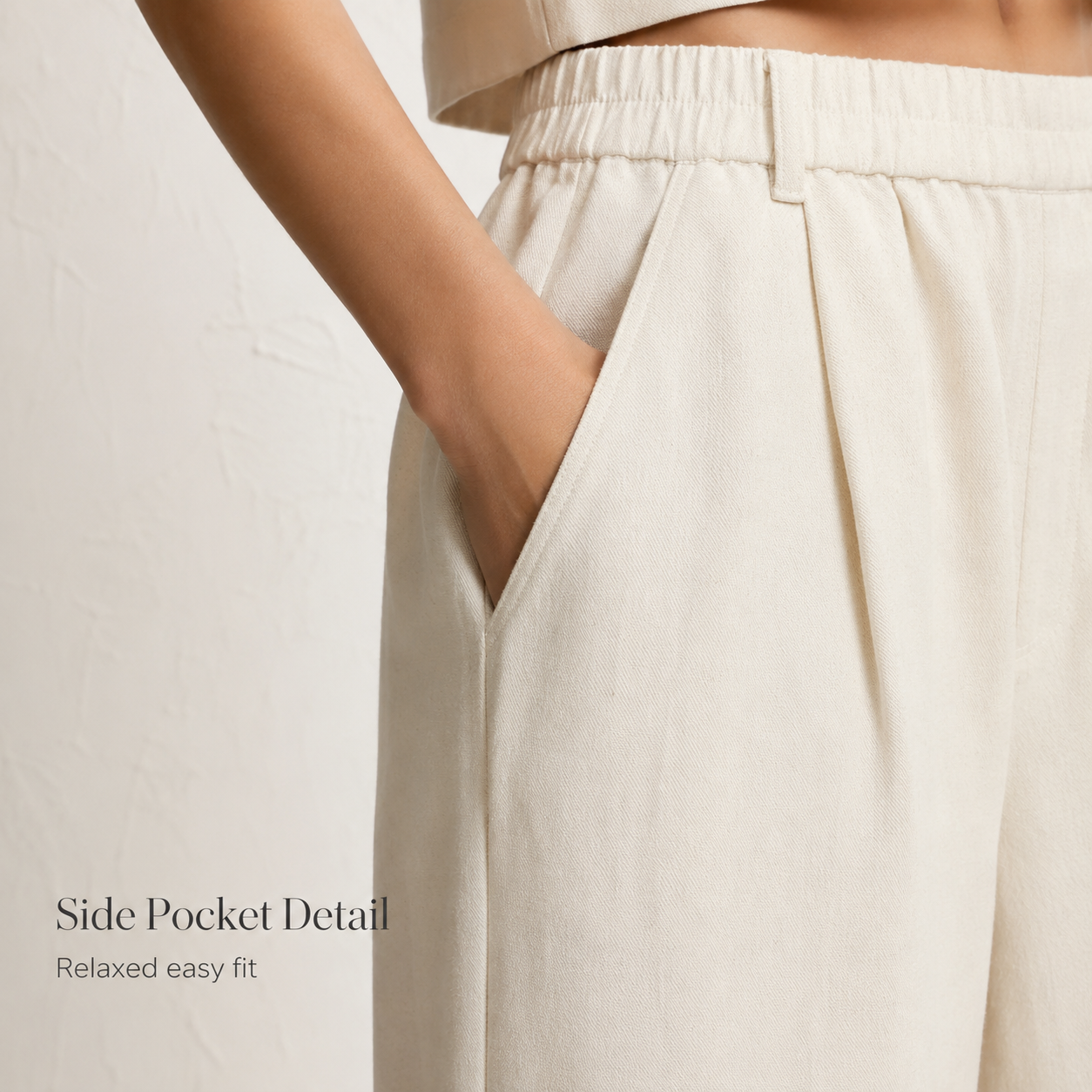 Side pocket and waistband detail of the pants