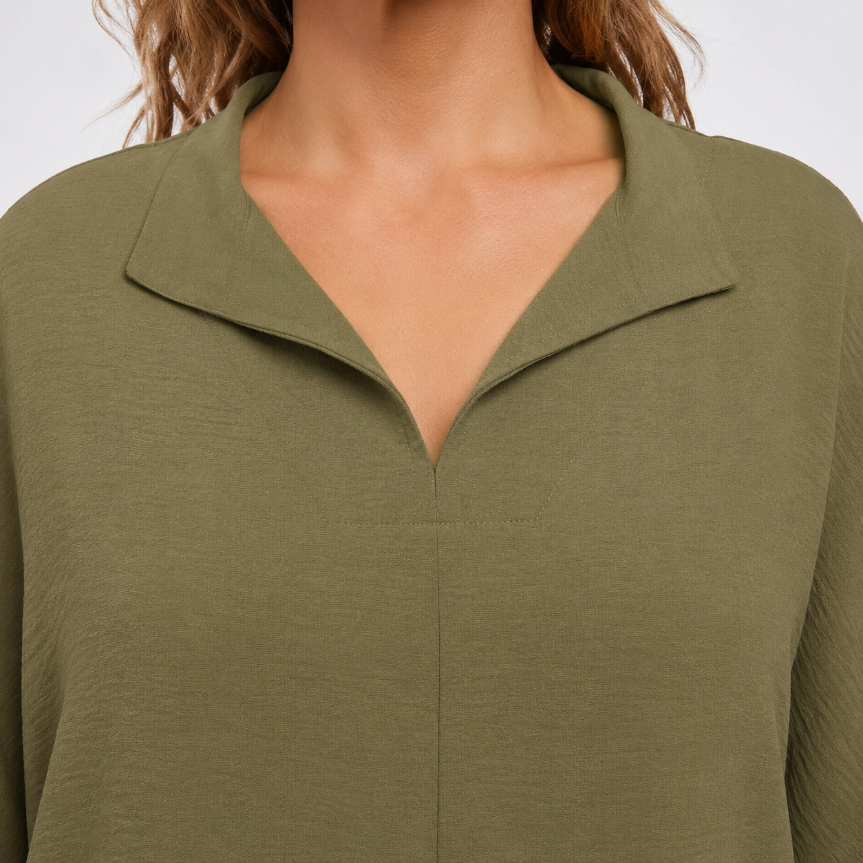 V-neck collar detail on loose-fit blouse