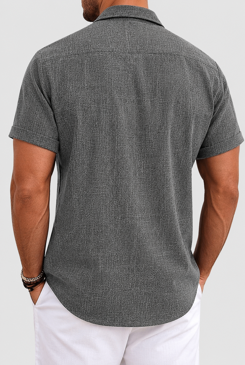 Back view of textured short-sleeve button-up shirt with yoke seam
