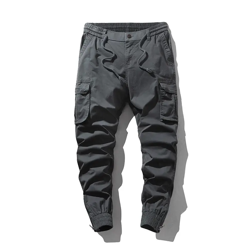 Stylish solid-color cargo pants featuring an elastic drawstring design, multiple pockets, and multiple flap details