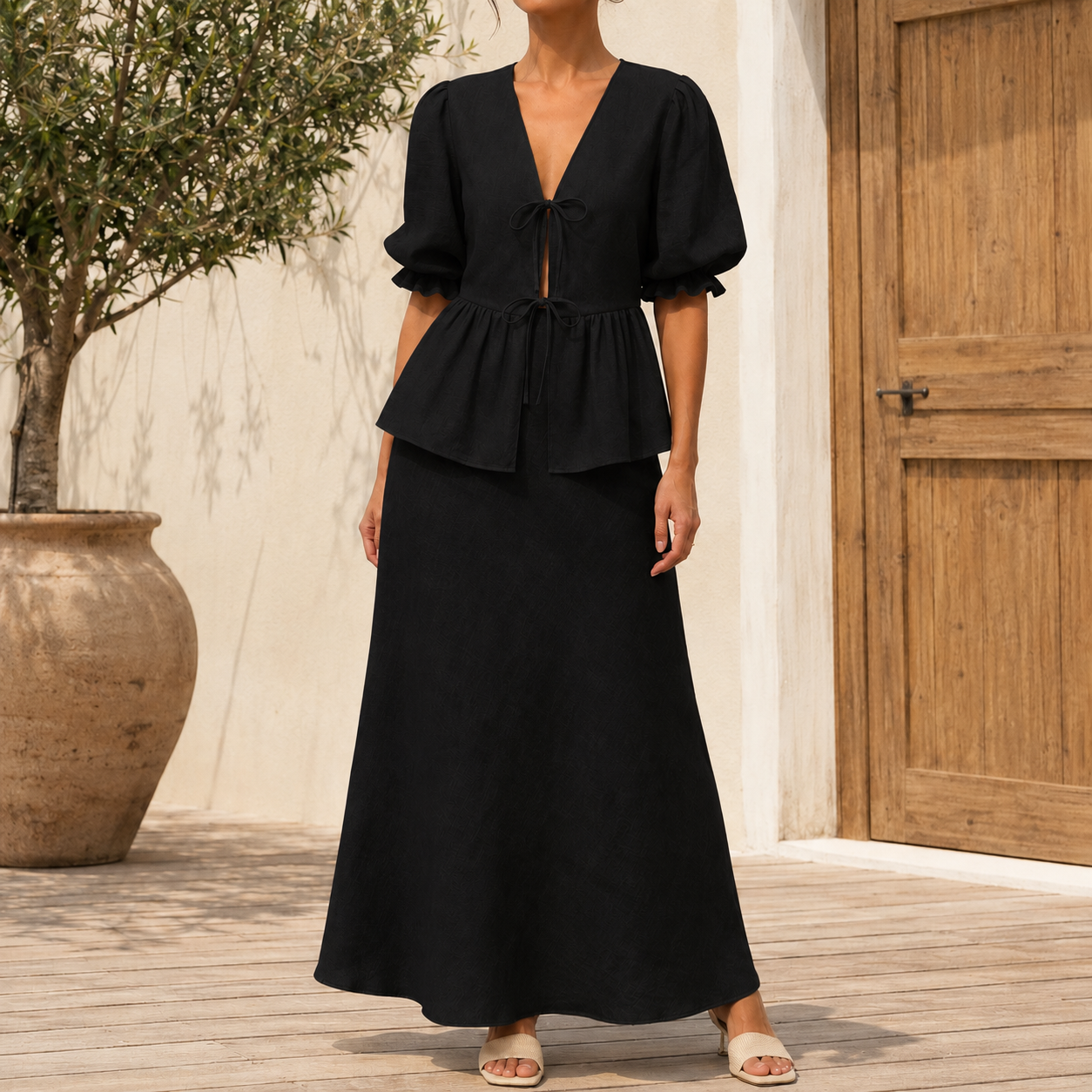 Classic black tie front puff sleeve top and maxi skirt on model