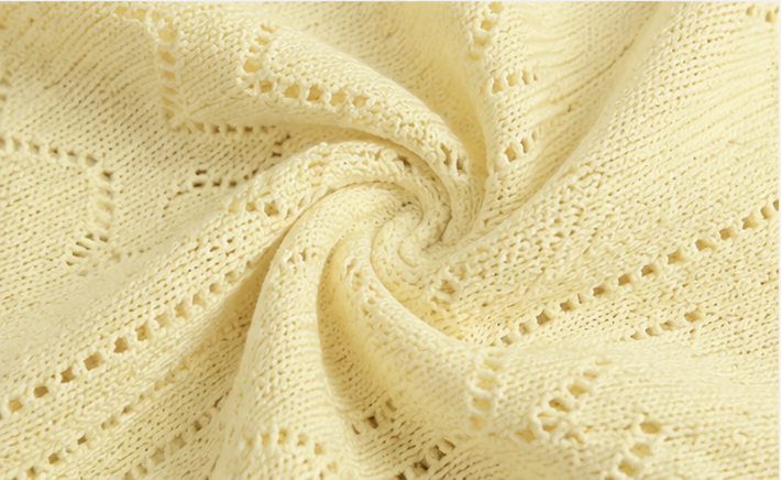 Close detail of the soft lightweight knit texture and breathable yarn handfeel