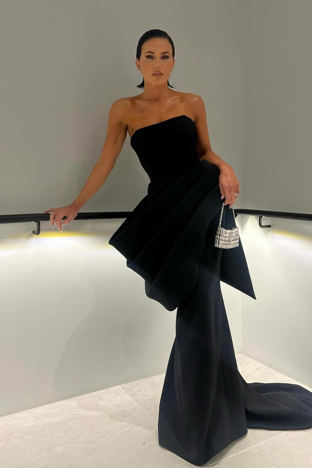 Elegant Strapless Black Mermaid Gown with Statement Draping
