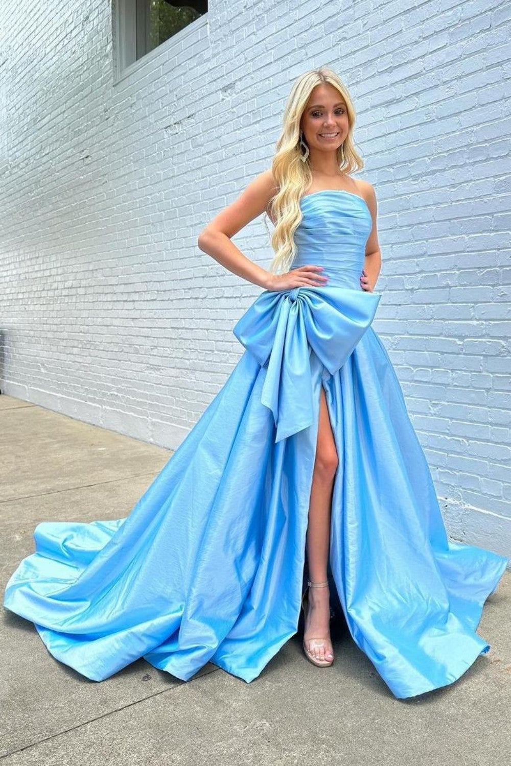 Light Blue Satin Prom Dress with Dramatic Bow and Flowy Skirt
