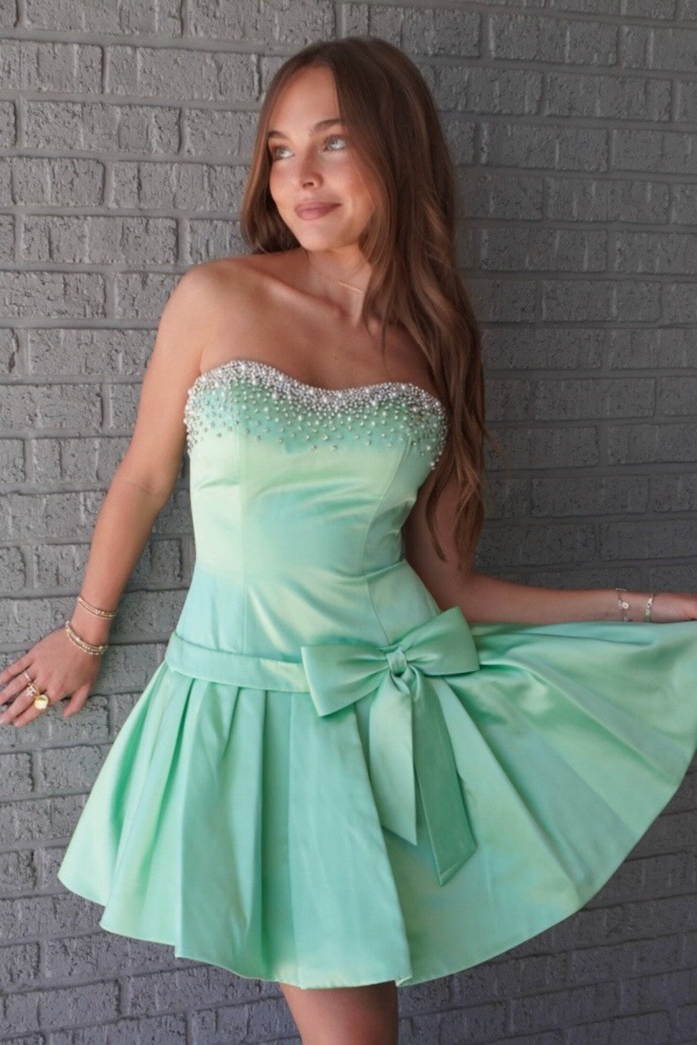 Mint Green Strapless Homecoming Dress with Beaded Neckline and Bow Skirt