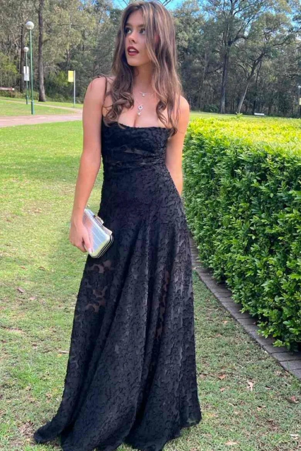 Sleek Black Lace Formal Dress with Spaghetti Straps and Flared Skirt