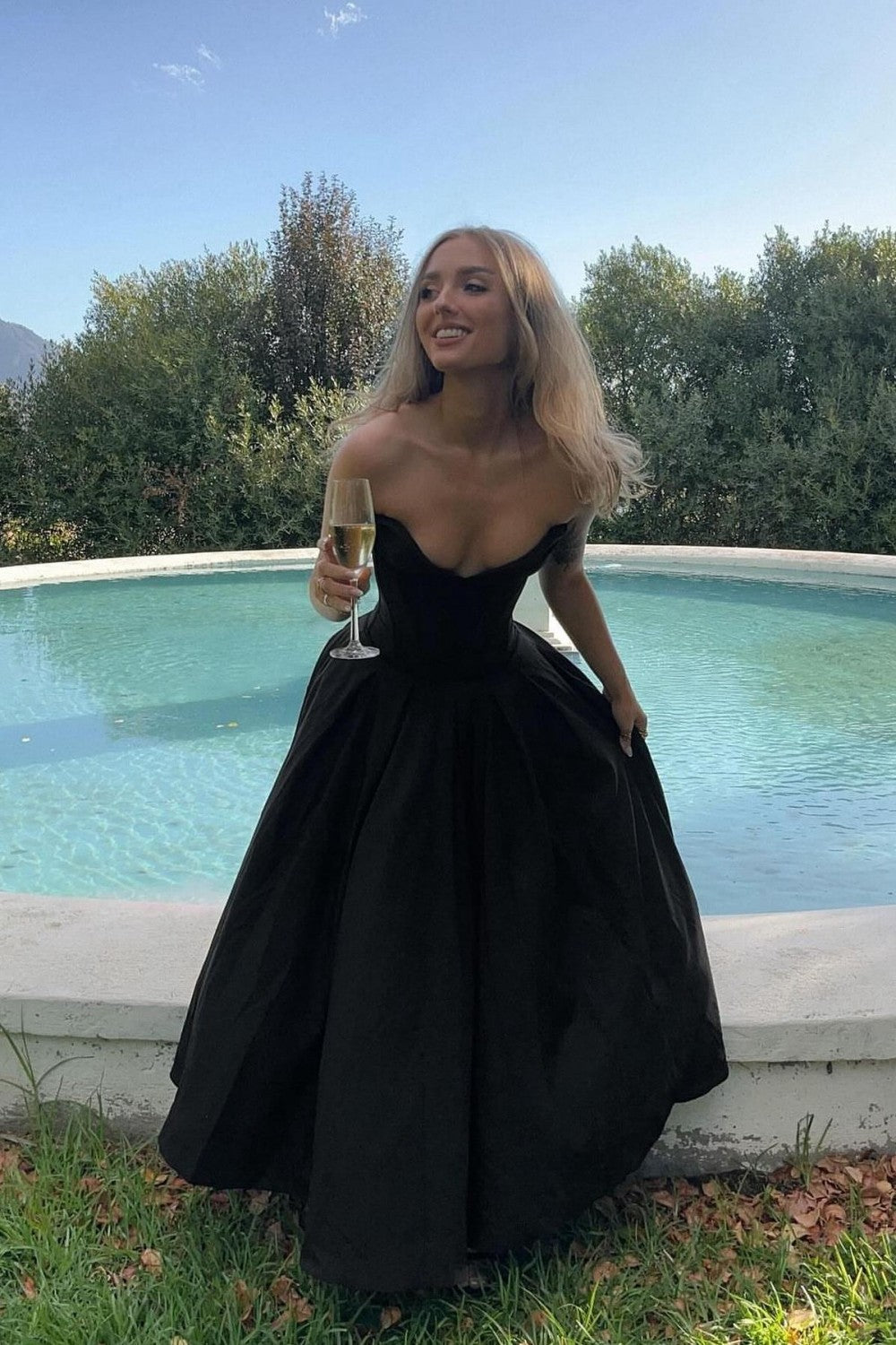 Strapless Black Formal Ball Gown with Structured Bodice