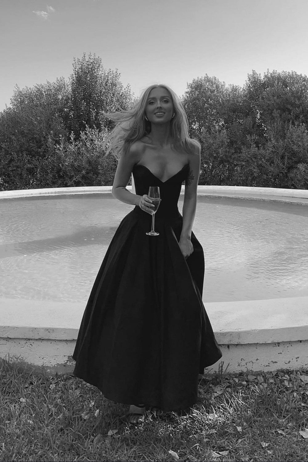 Strapless Black Formal Ball Gown with Structured Bodice