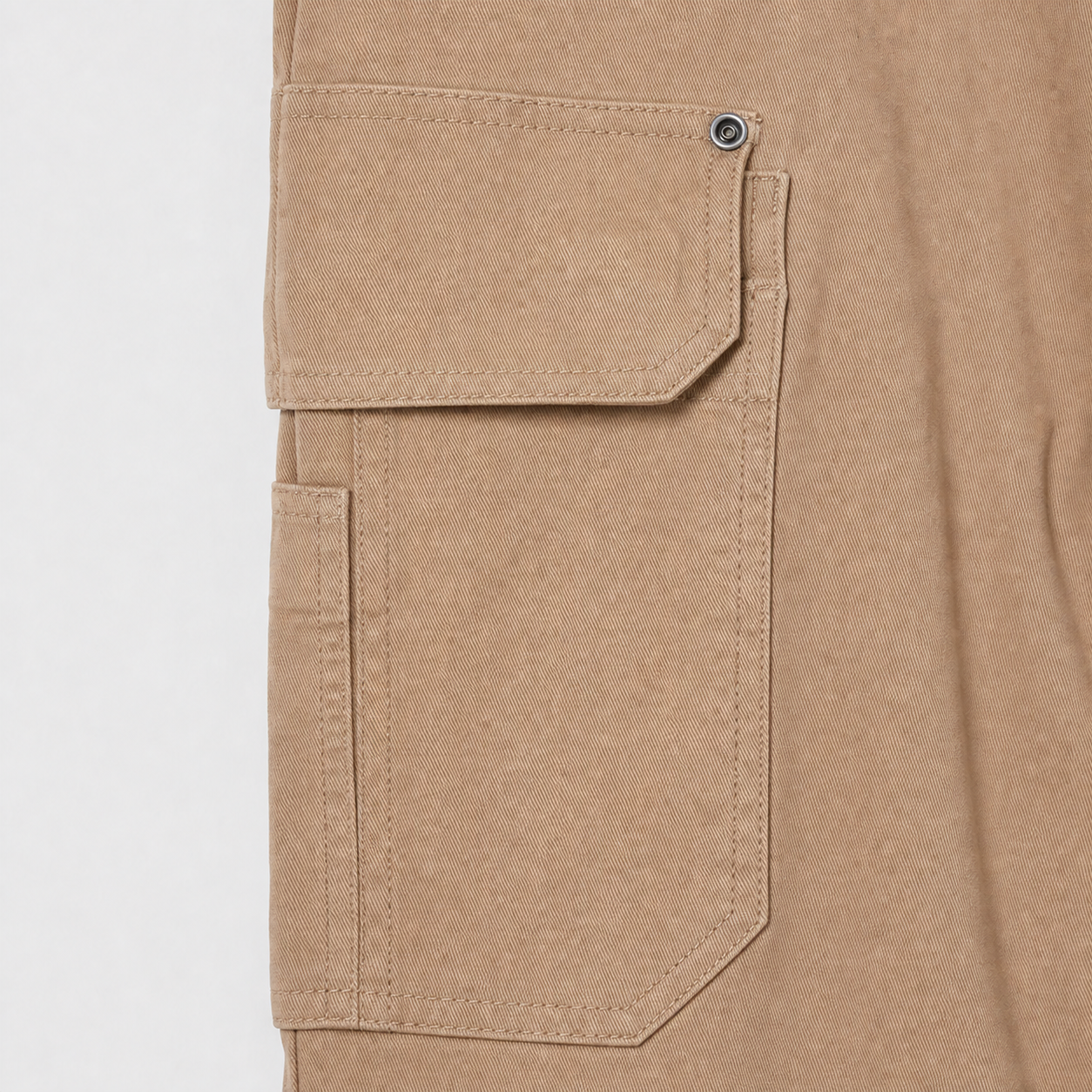 Layered riveted thigh cargo pocket construction detail