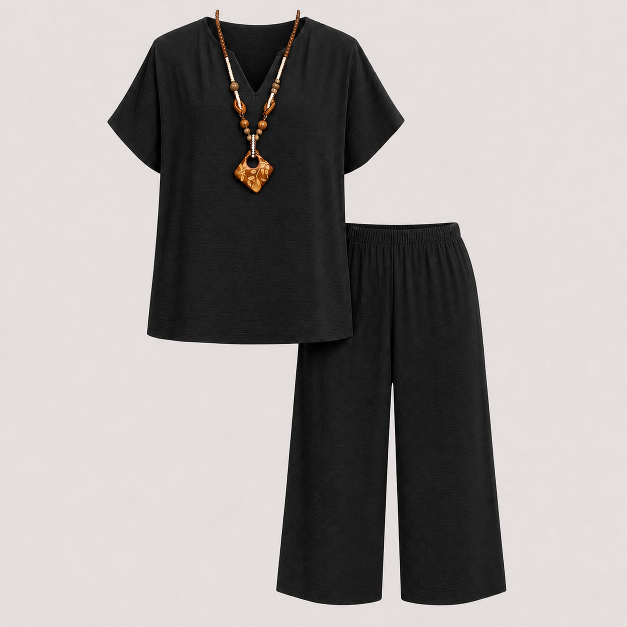 Black textured V-neck top and capri pants set