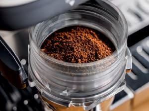 Image of ground coffee in portafilter with text reading three in one coffee maker with grinder.