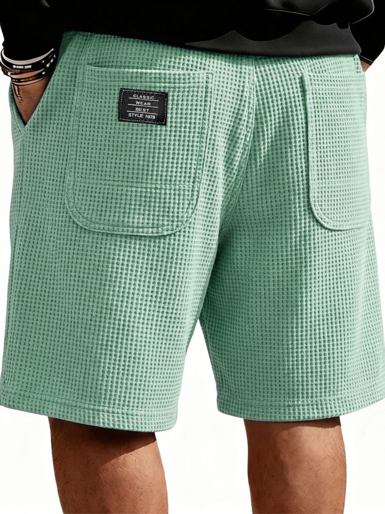 Herrenmode Freizeit Waffelmantel mit doppelten Taschen lockere Shorts-ZierMode
