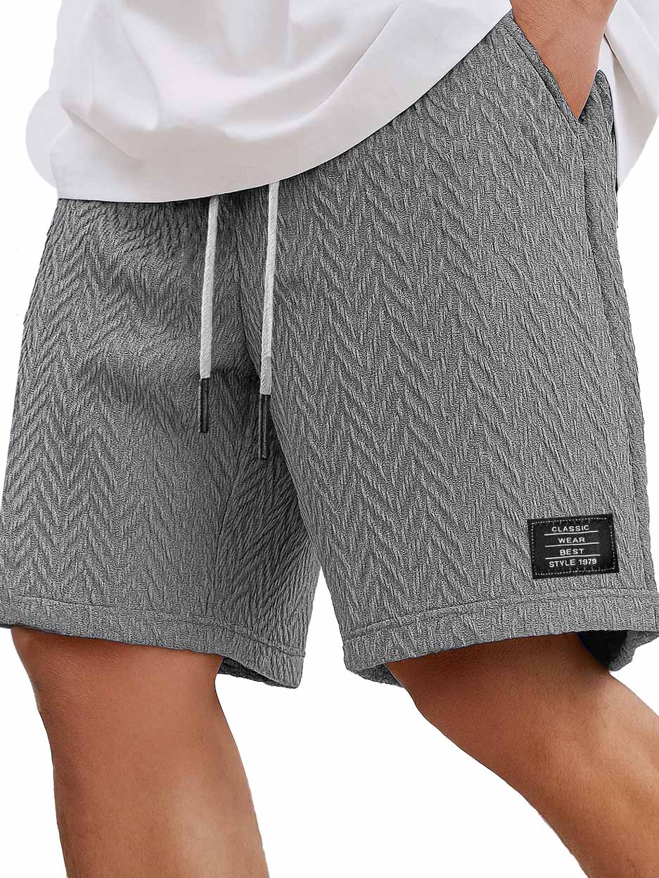 Herrenmode Freizeitliche tägliche strukturierte Stoff bestickte Logo Taschen Shorts-ZierMode