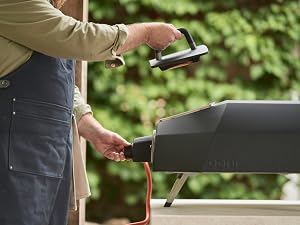 Attaching the gas burner to the back of the oven