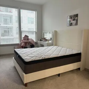 Customer bedroom with mattress on cream platform bed frame