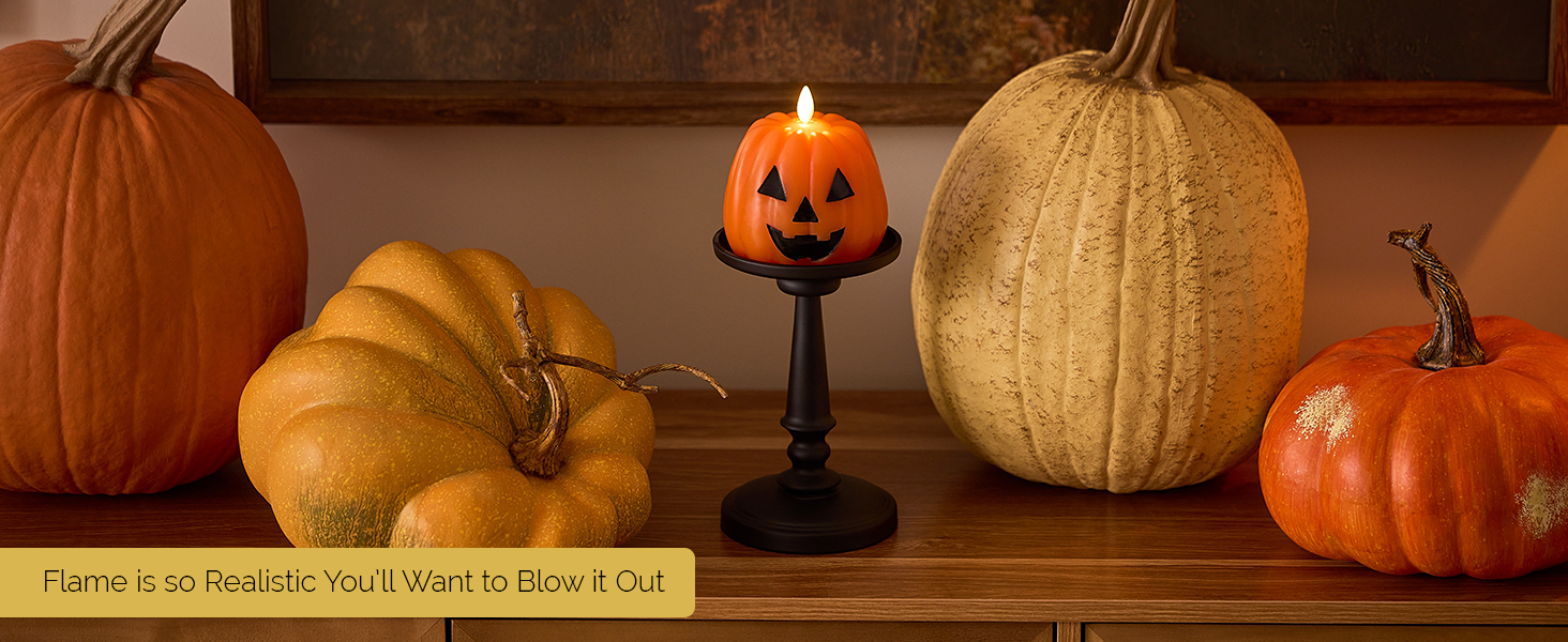 JJJSHOP pumpkin candle with realistic moving flame surrounded by autumn decor