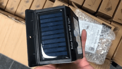 Solar-powered outdoor wall light with automatic motion detection