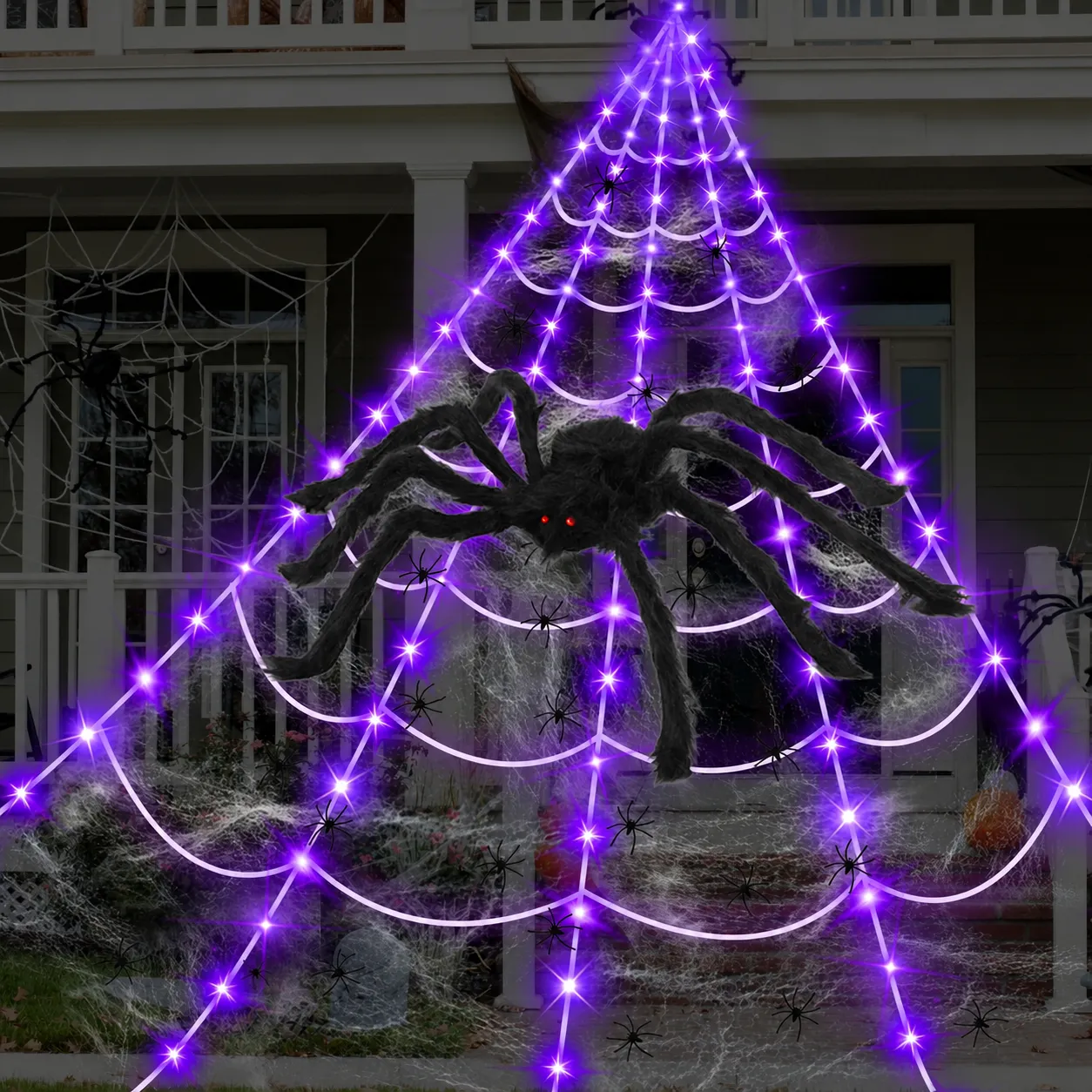 Purple glowing spider web decoration spread across a front porch