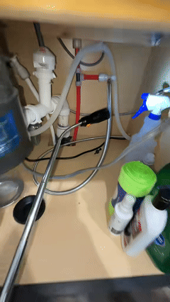 Telescoping magnetic pickup tool in use