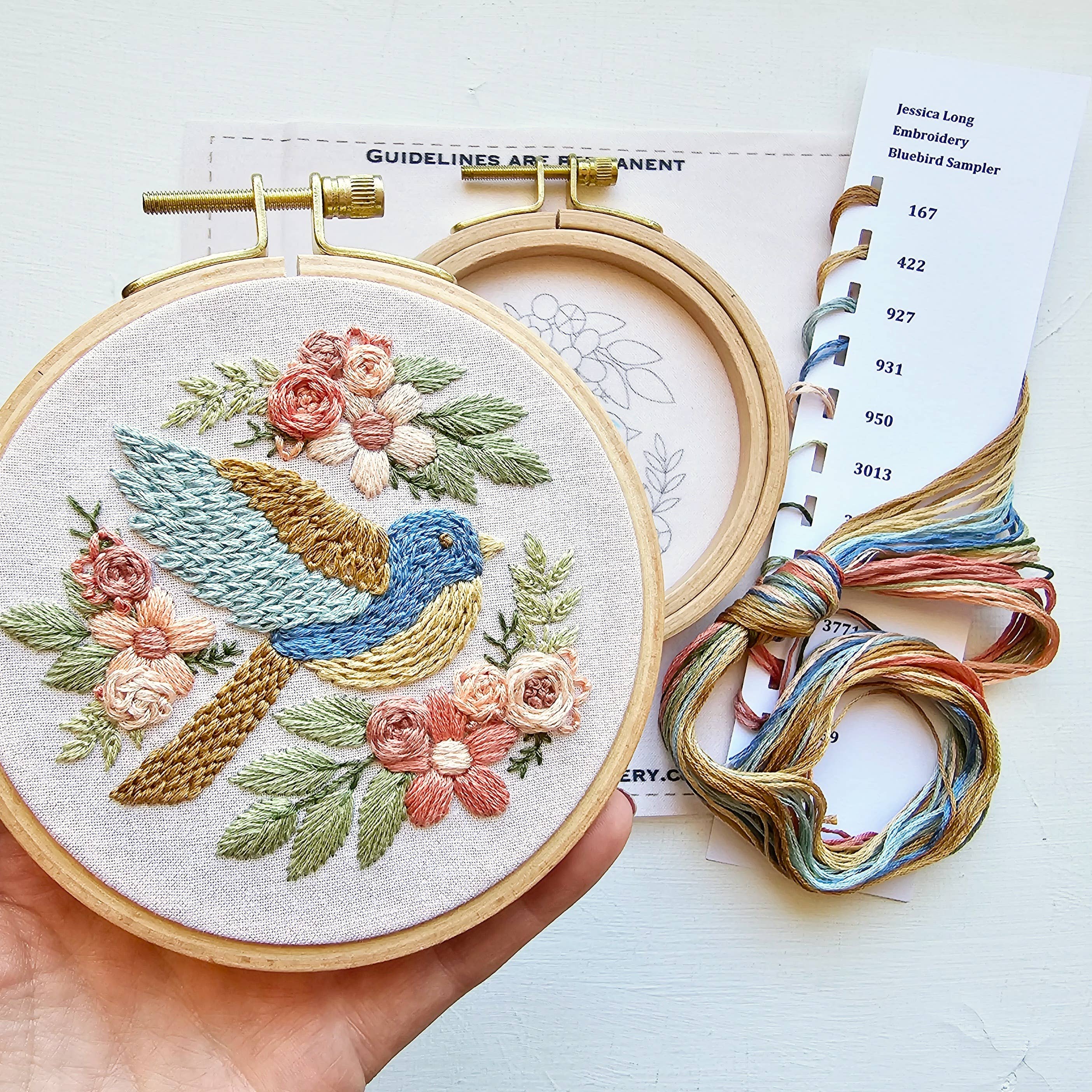 Bluebird embroidery sampler with embroidery floss and printed materials