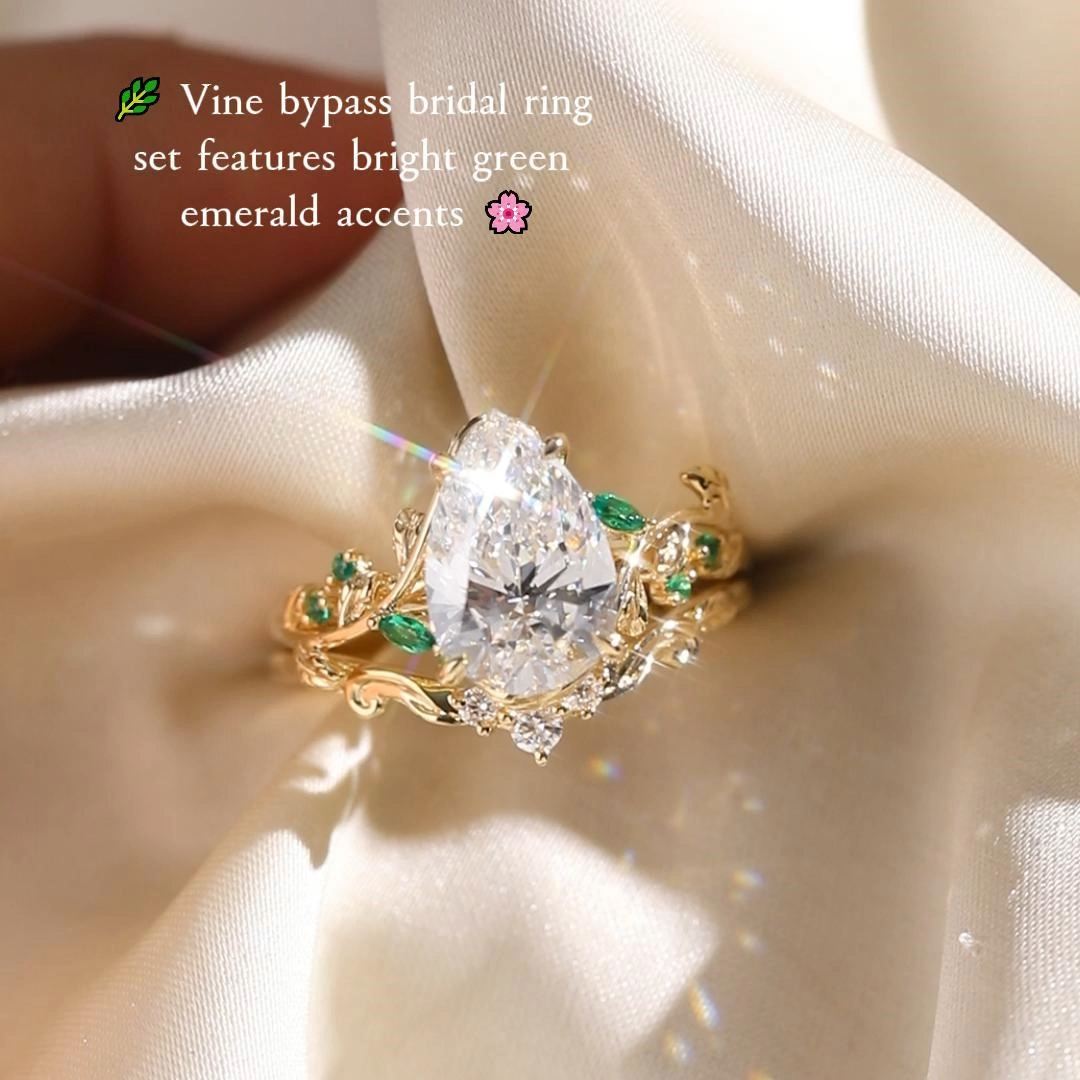 1ct Pear Cut Lab Grown Diamond Vine Bypass Bridal Ring Set with Dainty Round Accent Band and Emerald Accents in Rose Gold