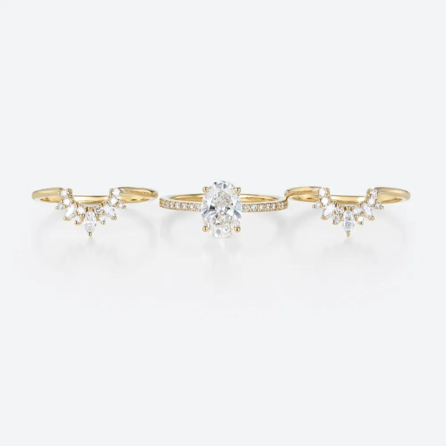 1.5ct Oval Cut Lab Grown Diamond Pavé Marquise Accent Three-Piece Bridal Ring Set in Yellow Gold