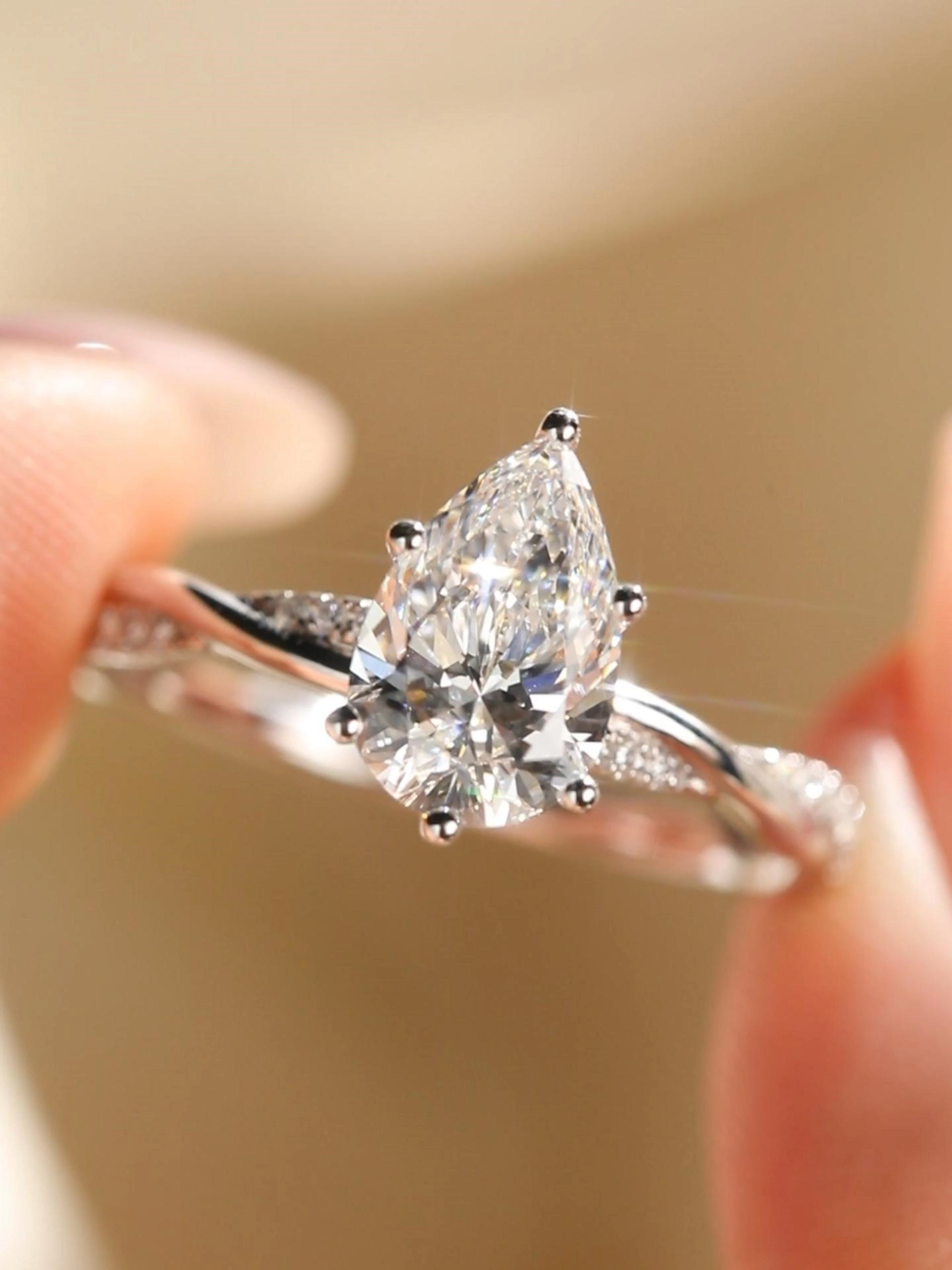 1ct Pear Cut Lab Grown Diamond Crossover Engagement Ring in Yellow Gold