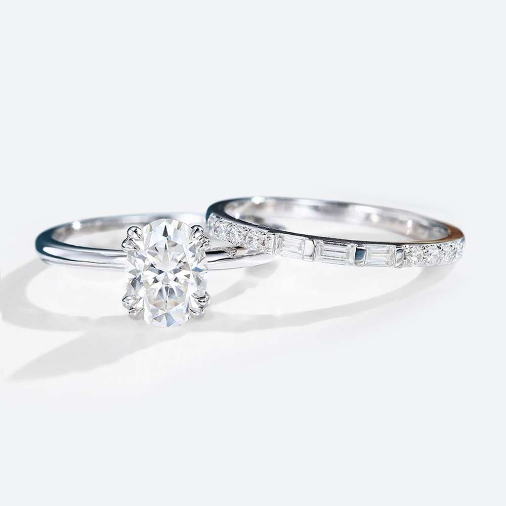 Oval Cut Moissanite Solitaire Bridal Ring Set with Straight Stacking Band in white gold
