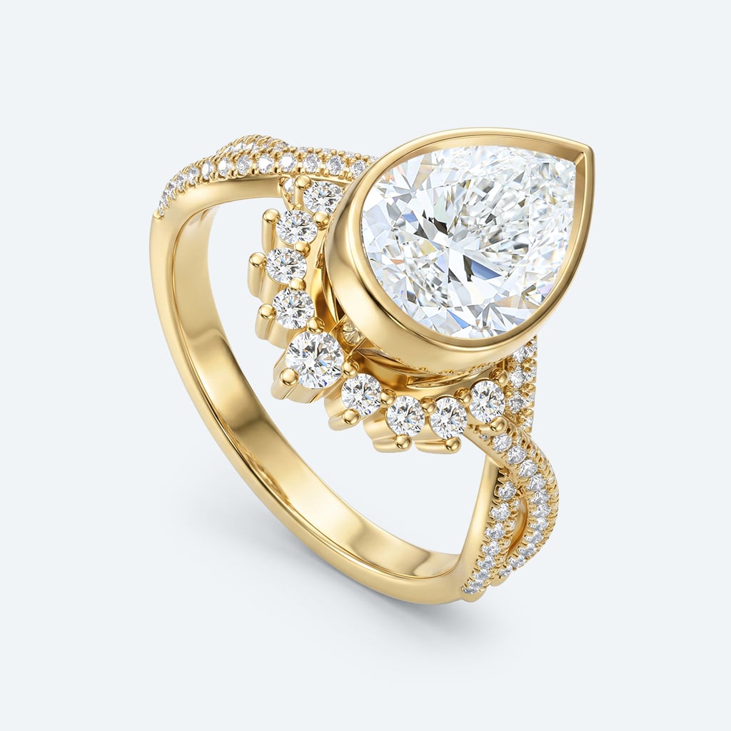 Pear Cut Lab Grown Diamond Twisting Pavé Band Bezel Setting Engagement Ring in Yellow Gold