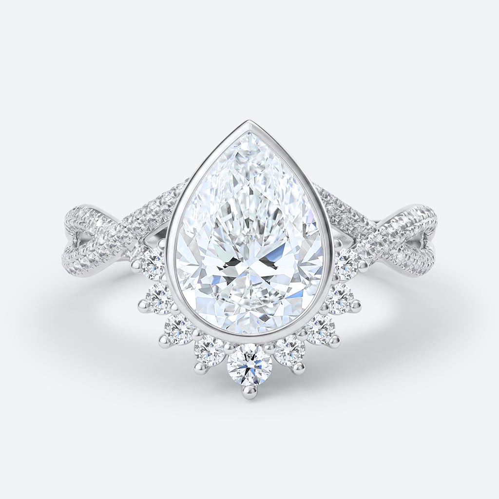 Pear Cut Lab Grown Diamond Twisting Pavé Band Bezel Setting Engagement Ring in White Gold