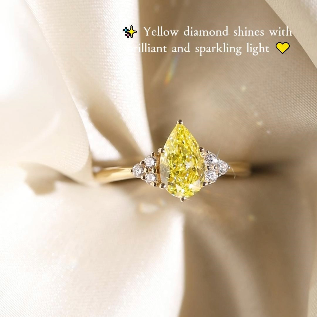1ct Pear Cut Lab Grown Yellow Diamond Six-Prong Marquise Cluster Engagement Ring in Yellow Gold
