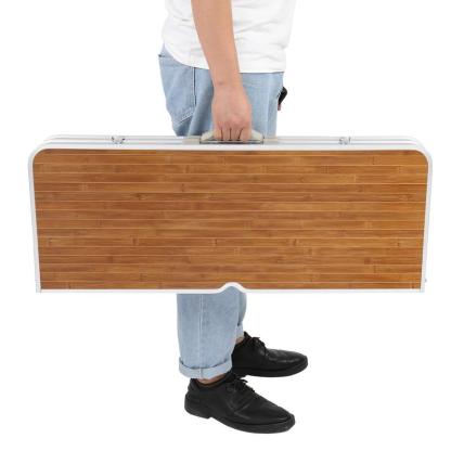 Mesa plegable de camping de 1.2 m con 4 asientos, estructura de aluminio resistente, soporta hasta 100 kg, diseño tipo maletín con orificio para sombrilla, ideal para picnic, BBQ, viajes, reuniones y RV.