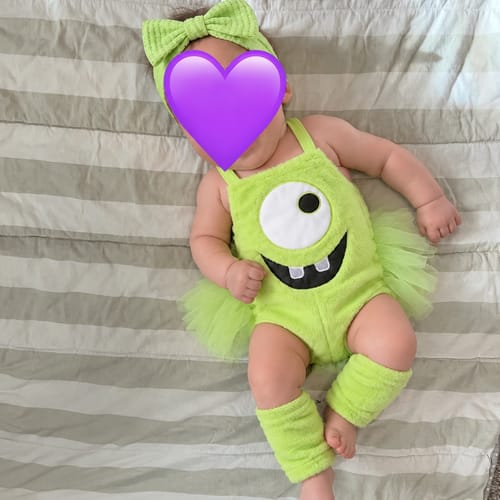 Green Monster baby outfit in a home photo