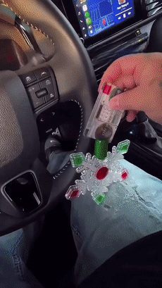 Sliding a contactless bank card into the Christmas wand