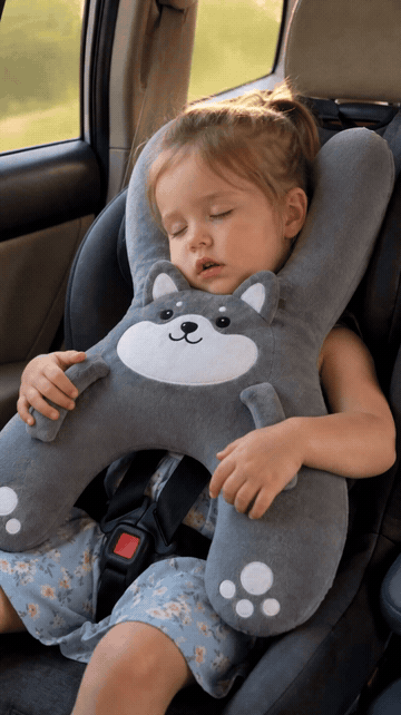 Animated demonstration of a child using the gray animal pillow